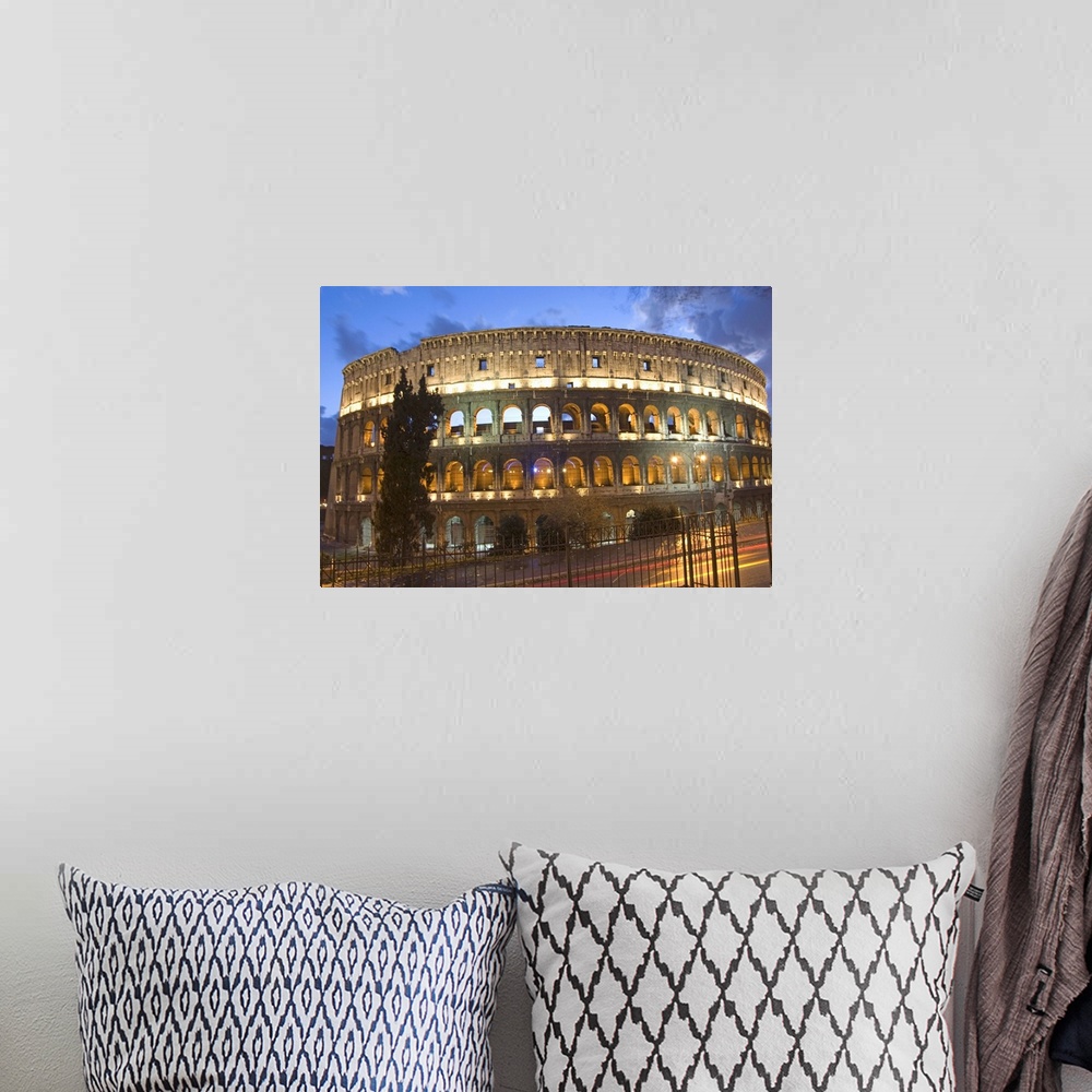 A bohemian room featuring The Colosseum at night with traffic trails, Rome, Lazio, Italy