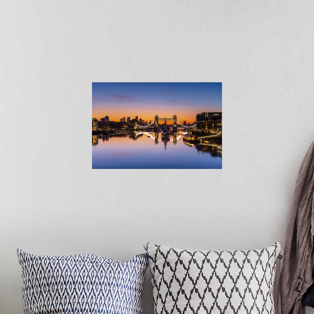 A bohemian room featuring Tower Bridge, HMS Belfast and reflections in a still River Thames at sunrise, London, England, Un...