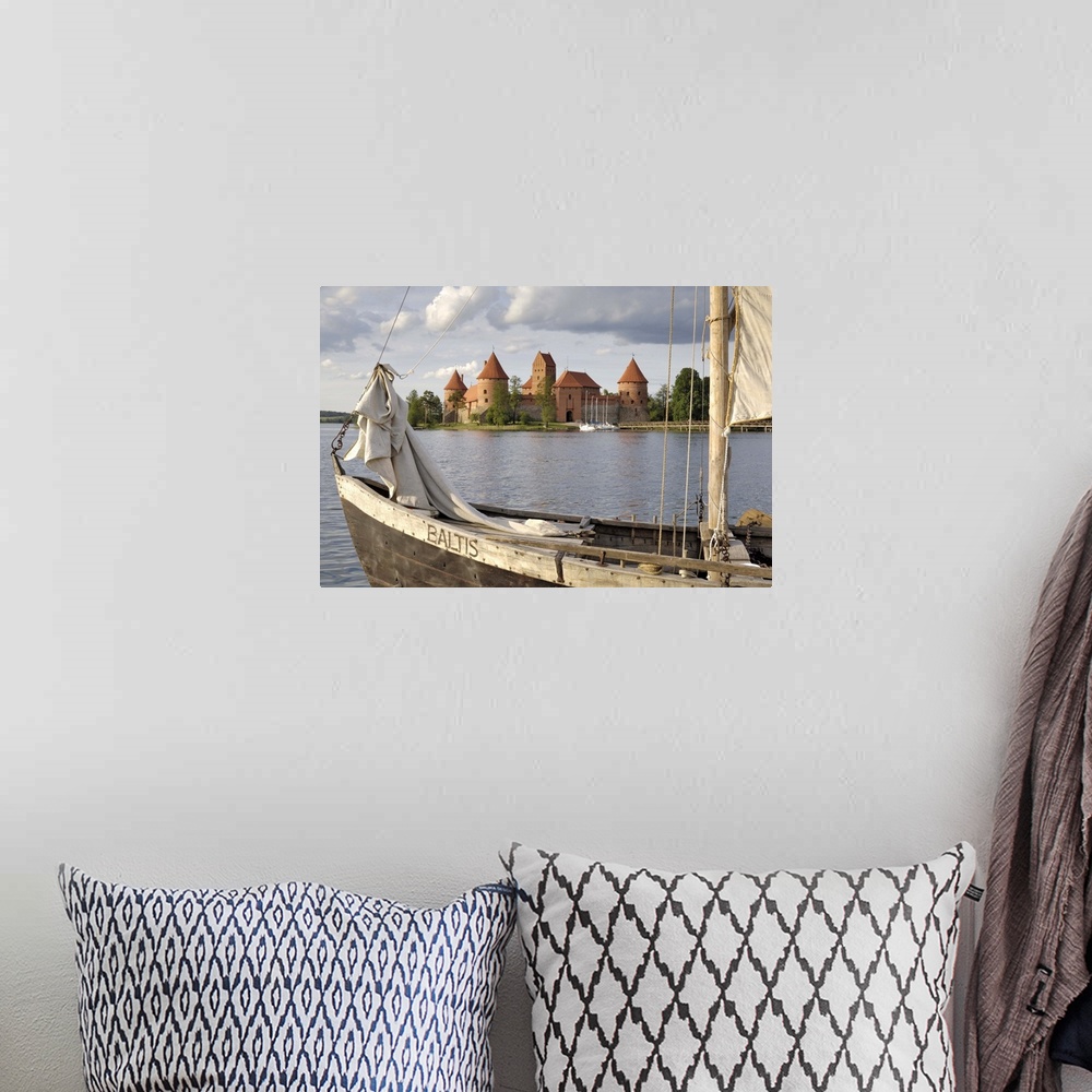 A bohemian room featuring Traditional boat and Trakai Castle, Trakai, near Vilnius, Lithuania, Baltic States