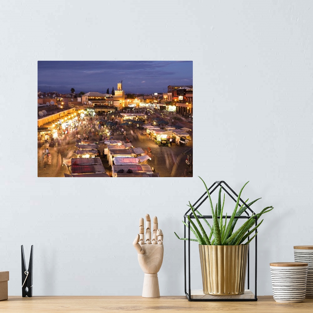 A bohemian room featuring View over Djemaa el Fna at dusk with foodstalls and crowds of people, Marrakech, Morocco, North A...