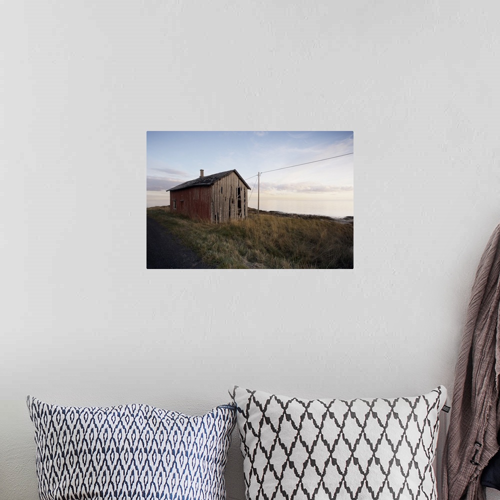 A bohemian room featuring Weathered barn on coast, Lofoten Islands, Norway, Scandinavia, Europe