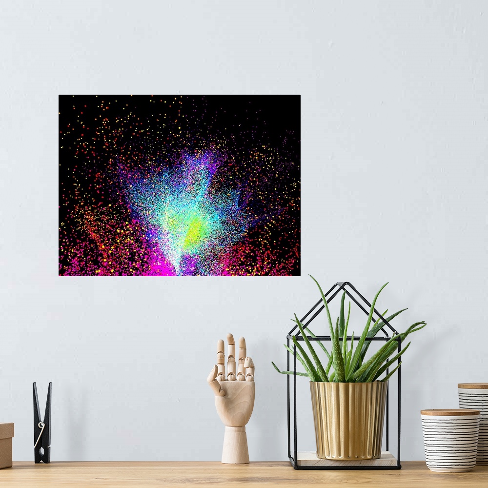 A bohemian room featuring Computer artwork of a particle burst or explosion.