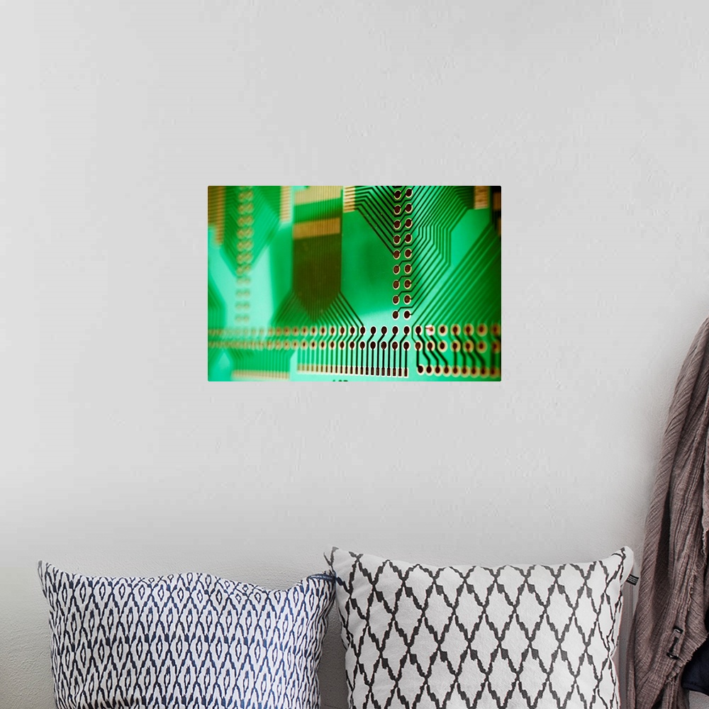 A bohemian room featuring Printed circuit board (PCB), showing the holes into which component connections are inserted and ...