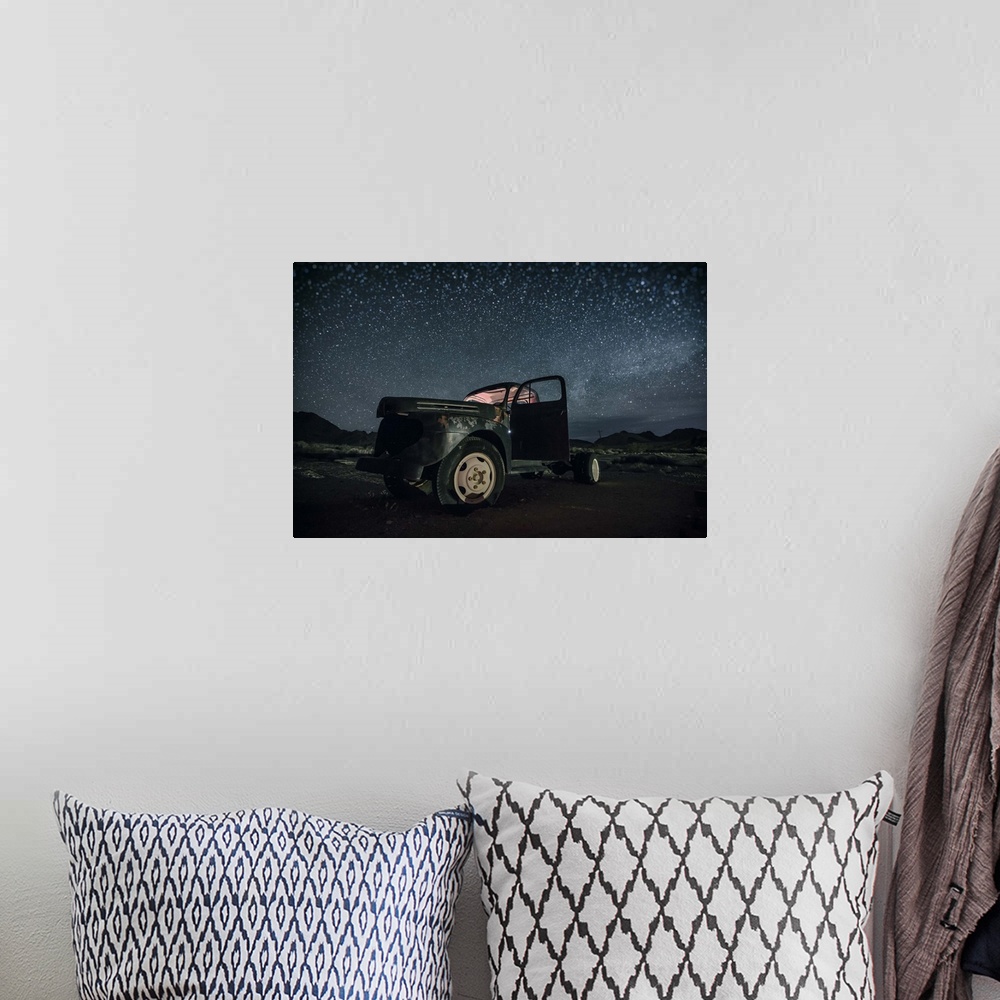 A bohemian room featuring Abandoned old truck with the stars and the night sky