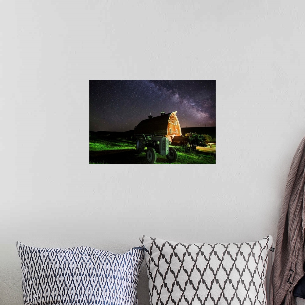 A bohemian room featuring Milky Way over tractor and red barn in the Palouse.