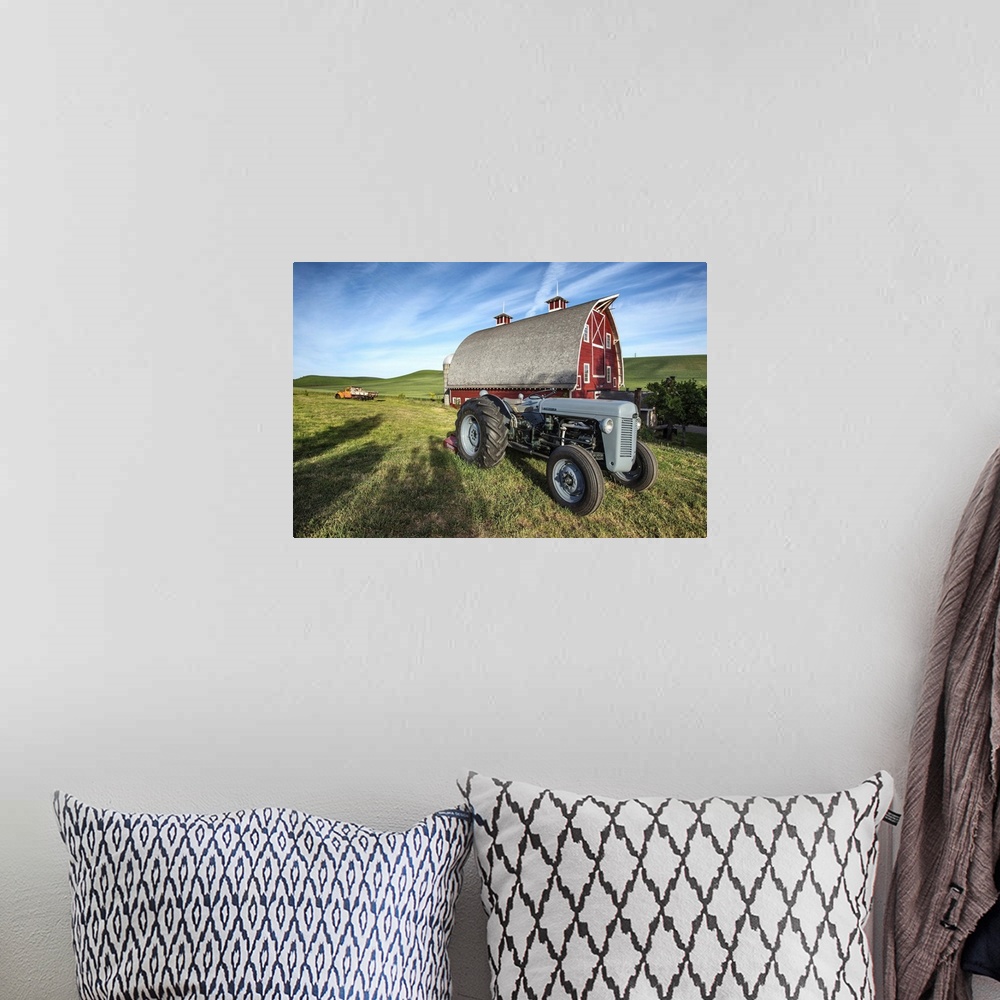 A bohemian room featuring Old tractor and red barn in the Palouse, Washington