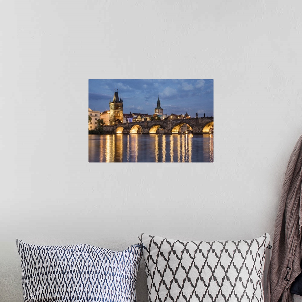 A bohemian room featuring The stunning Charles Bridge and Prague at sunset.