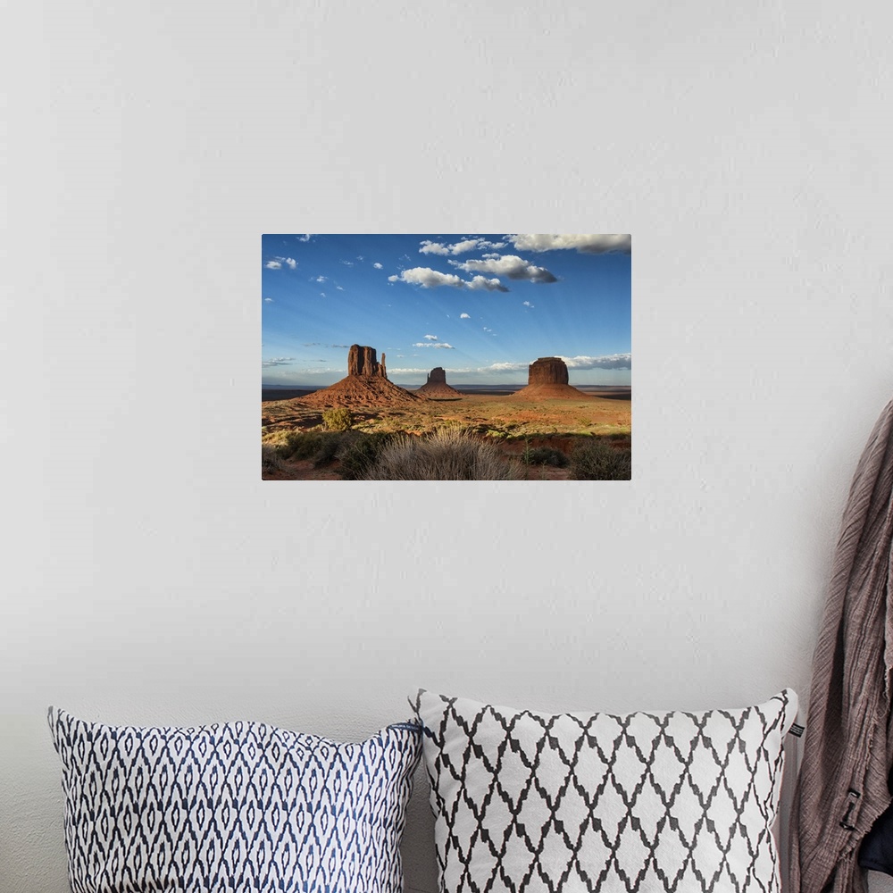 A bohemian room featuring The MIttens at sunset in Monument Valley, Utah