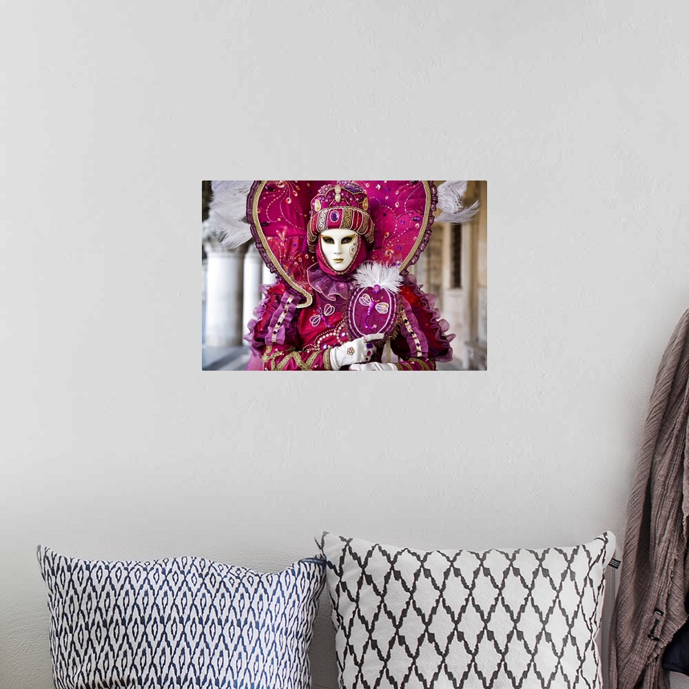 A bohemian room featuring Woman in masquerade outfit at Carnival in Venice, Italy.