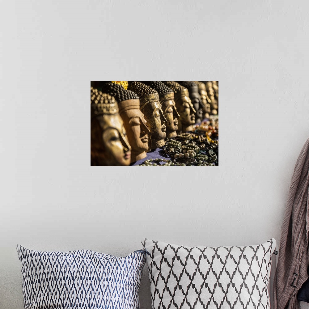 A bohemian room featuring Wooden buddha heads in Inle Lake, Burma