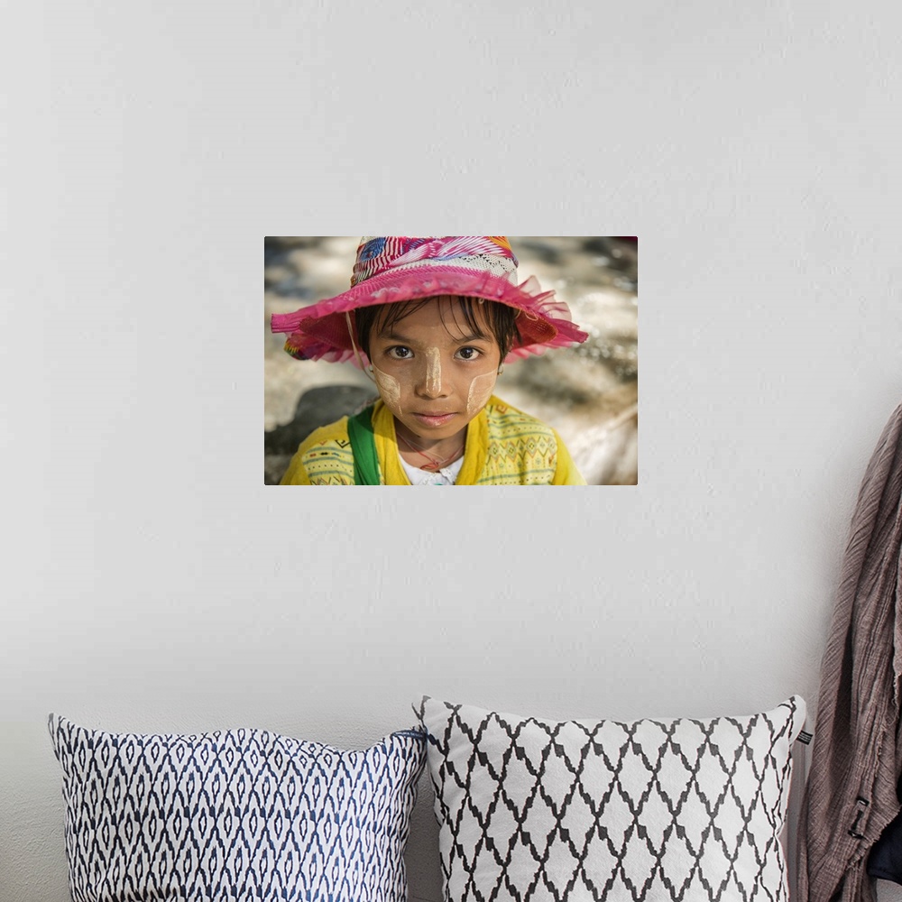 A bohemian room featuring Young Burmese girl with Tanaka face paint