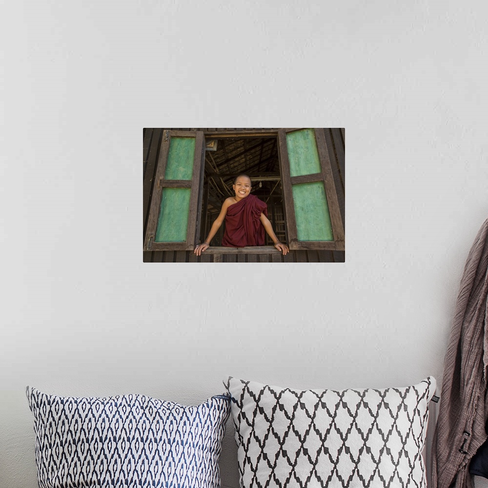 A bohemian room featuring Young Burmese monk in his monastery