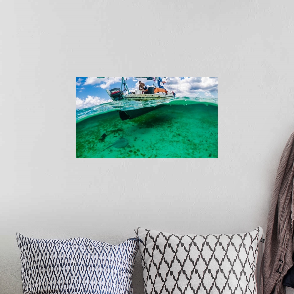A bohemian room featuring Gypsy Fisherman on the clear water of Southern Belize