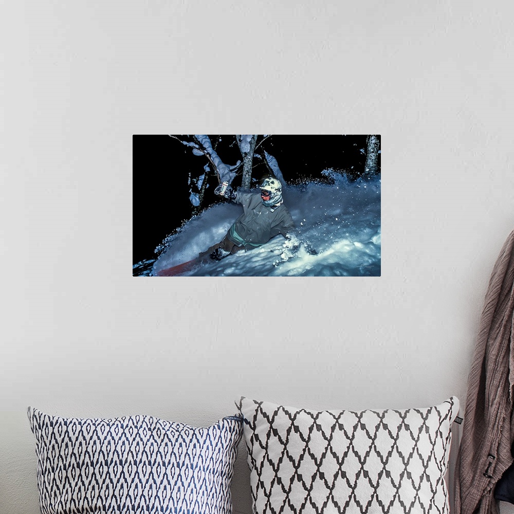 A bohemian room featuring Vintage photo of Mike Ranquet as he rides some night powder while enjoying a beer in Niseko, Japa...