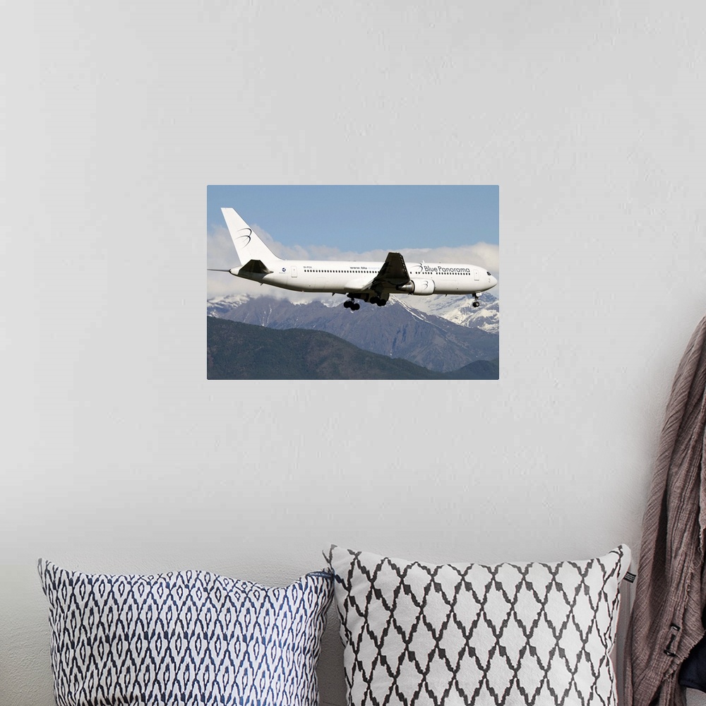 A bohemian room featuring A Boeing 767 of Blue Panorama Airlines flying over Italy.