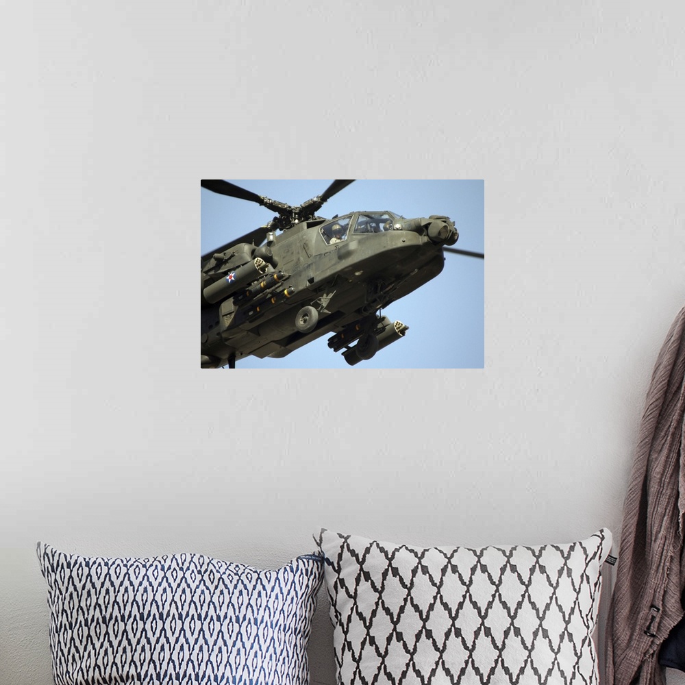 A bohemian room featuring An AH64 Apache in flight over the Baghdad Hotel in central Baghdad Iraq