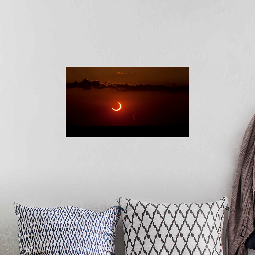 A bohemian room featuring Annular solar eclipse of 2012.