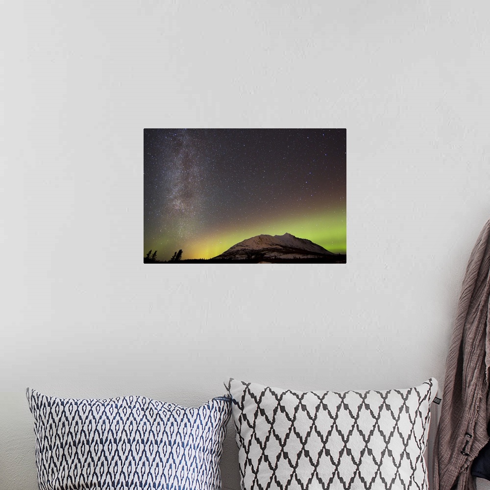 A bohemian room featuring Aurora borealis and Milky Way over Carcross Desert, Carcross, Yukon, Canada.