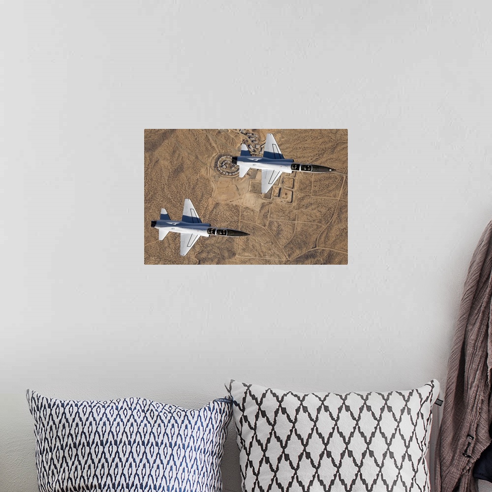 A bohemian room featuring NASA Drydens two T38A mission support aircraft fly in tight formation
