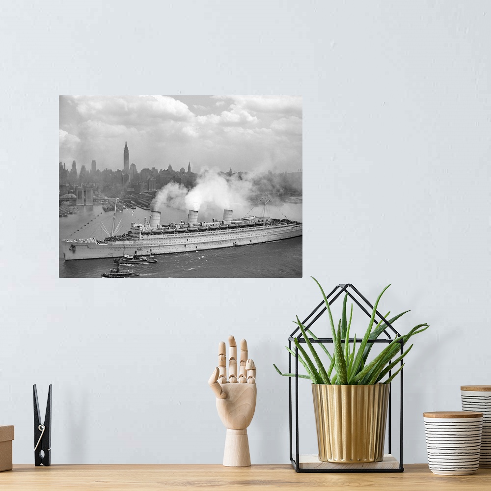 A bohemian room featuring Vintage World War II photo of the British liner RMS Queen Mary arriving in New York harbor, June ...