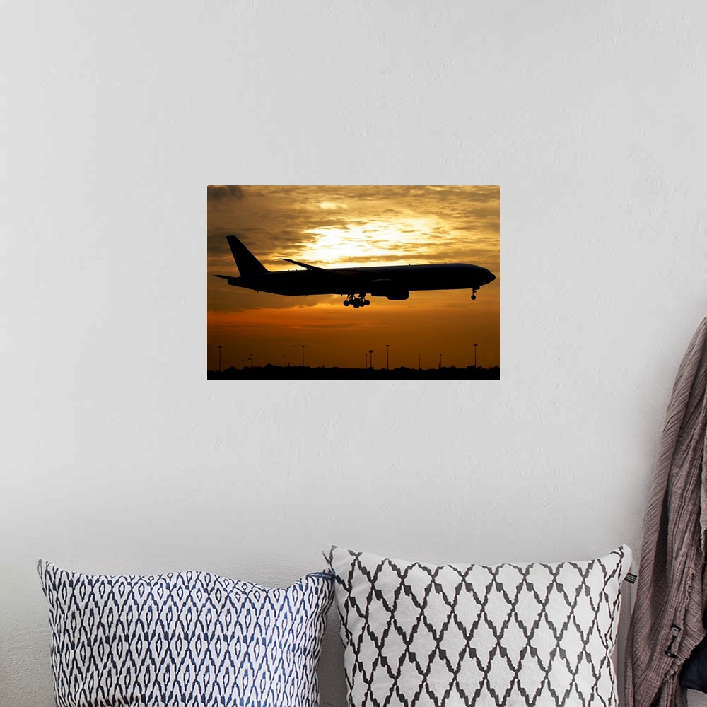 A bohemian room featuring Silhouette of a Pakistan International Airlines Boeing 777, Milano Malpensa Airport, Italy.
