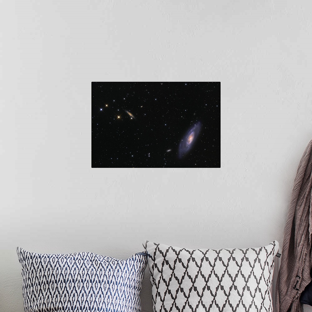 A bohemian room featuring Spiral galaxy Messier 106.