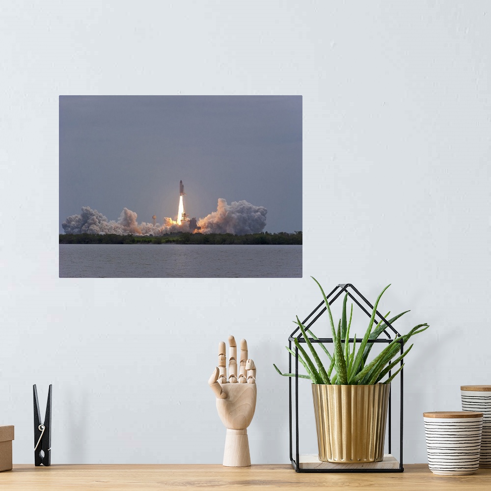 A bohemian room featuring July 8, 2011 - The final launch of Space Shuttle Atlantis from Kennedy Space Center, Cape Canaver...
