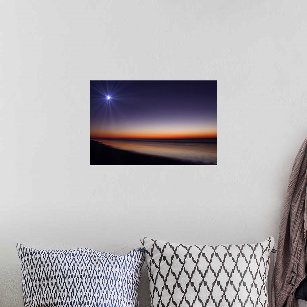 A bohemian room featuring Big photo on canvas of a bright moon and Venus in the dusk sky above an ocean.