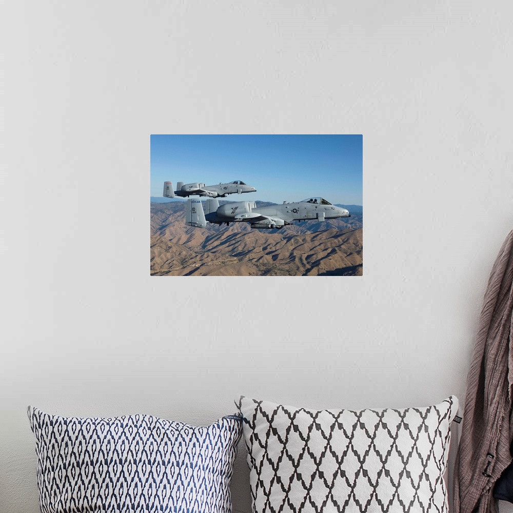 A bohemian room featuring Two A-10 Thunderbolt's from the 124th Fighter Wing's 190th Fighter Squadron fly over Central Idaho.