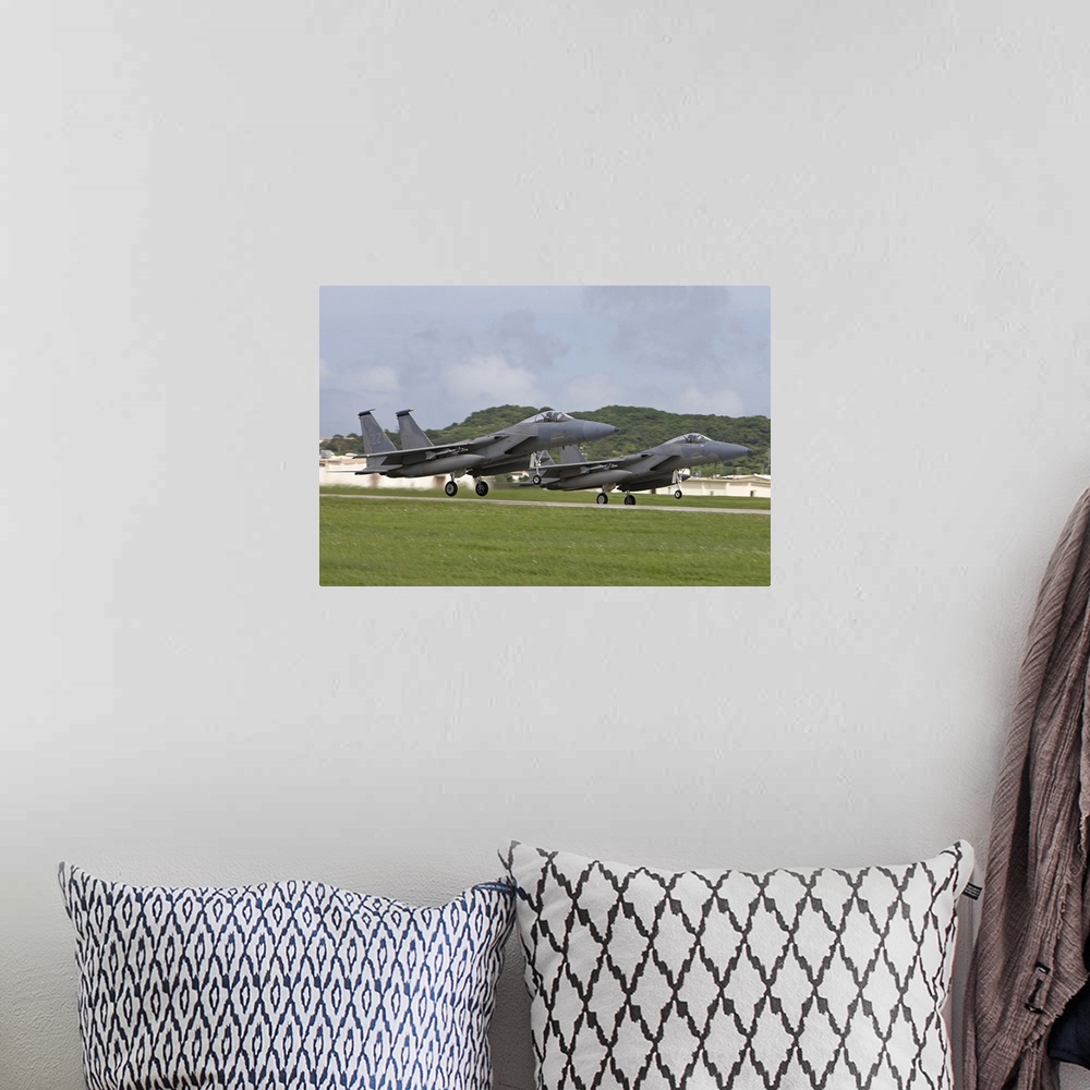 A bohemian room featuring Two F-15's from the 18th Wing take off in formation at Kadena Air Base, Okinawa, Japan.