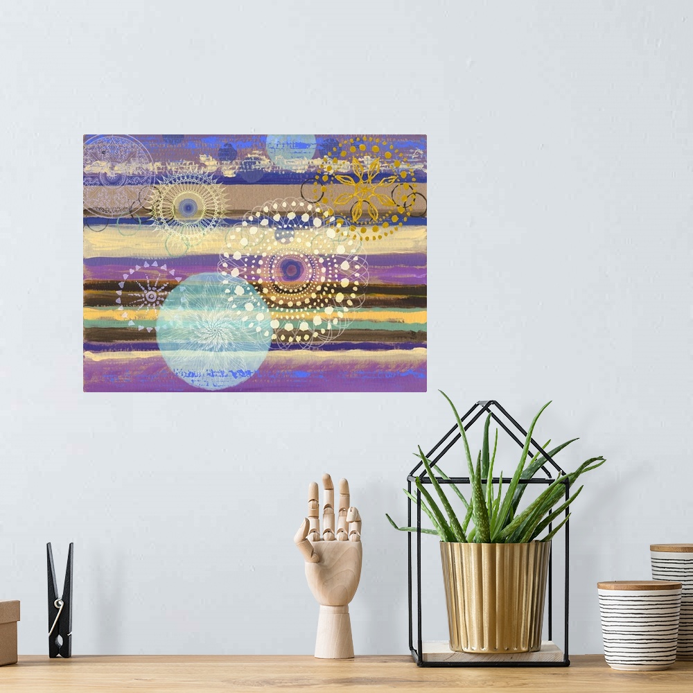 A bohemian room featuring Abstract artwork of horizontal layers of yellow and purple, embellished with circular prints.