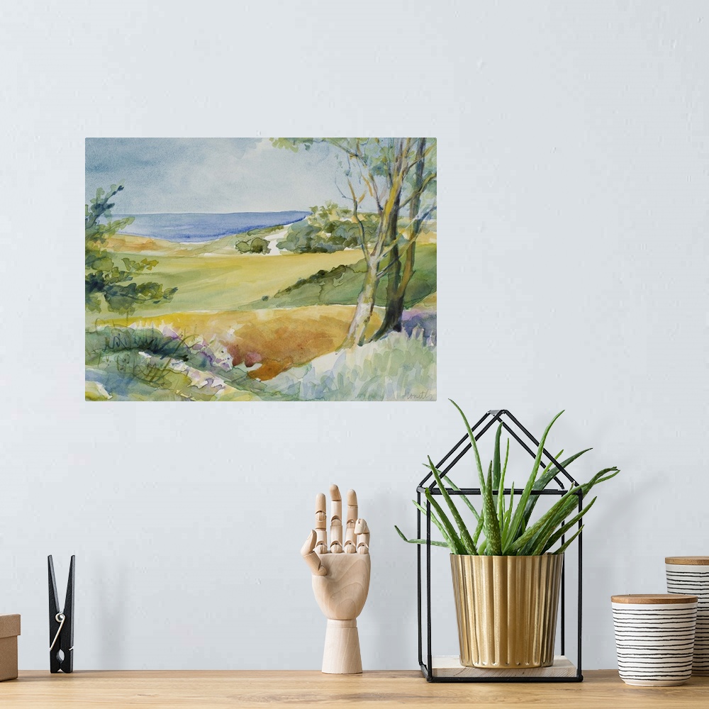 A bohemian room featuring Watercolor landscape painting of trees and bushes overlooking the ocean.