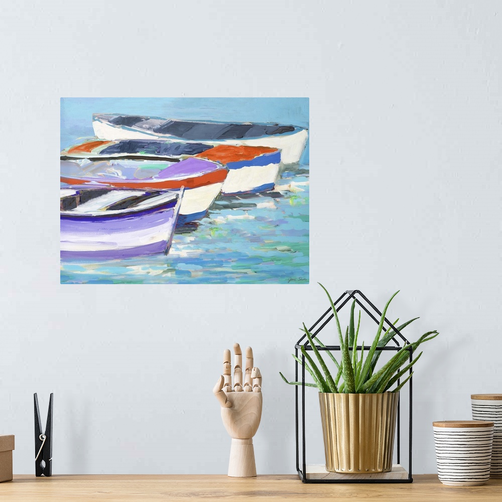 A bohemian room featuring Painting of four boats in a row on the water.