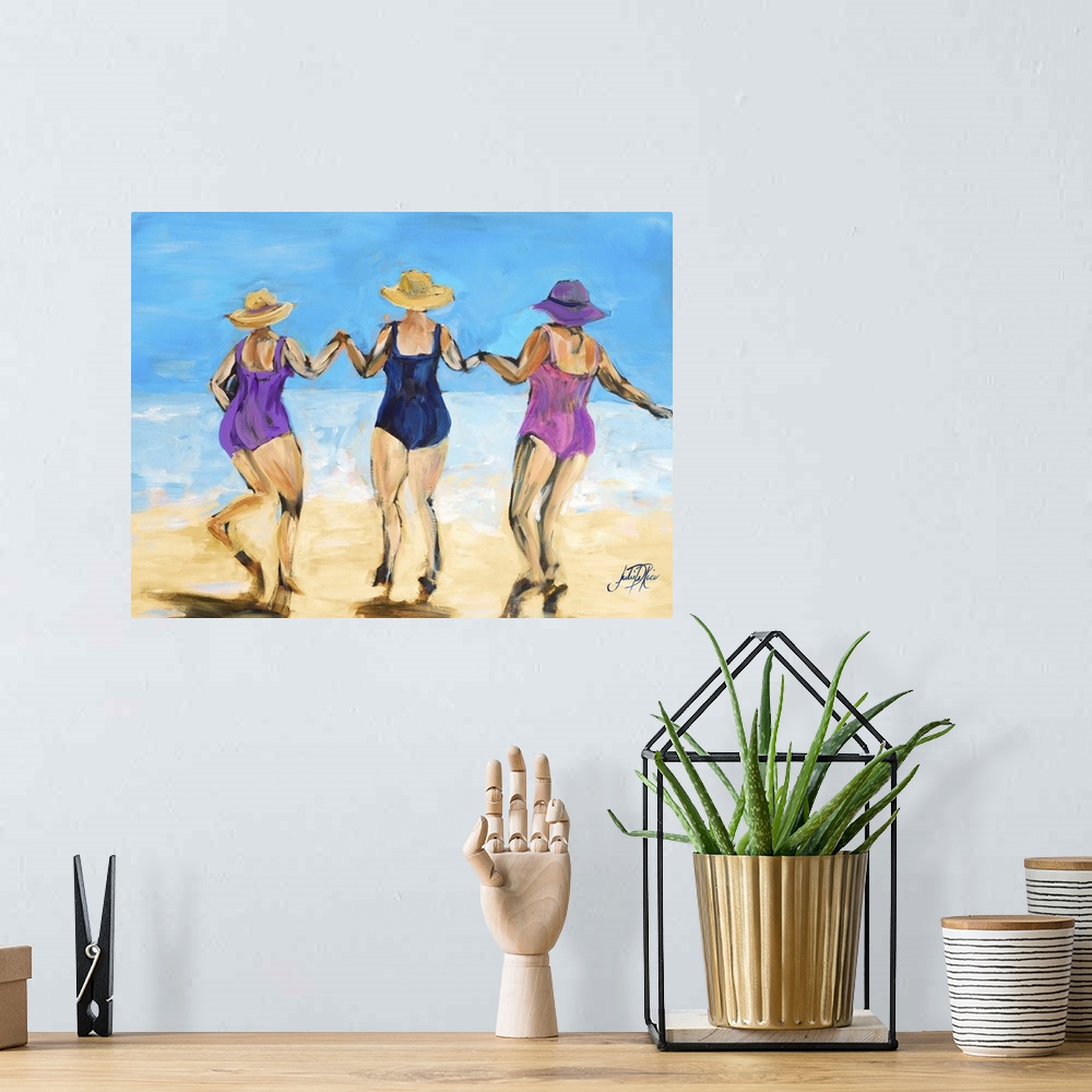 A bohemian room featuring Painting of three ladies in hats and swimsuits playing on the beach.