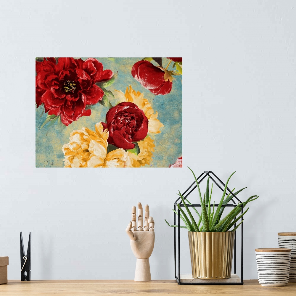 A bohemian room featuring Painting of a close-up of red and yellow flowers.