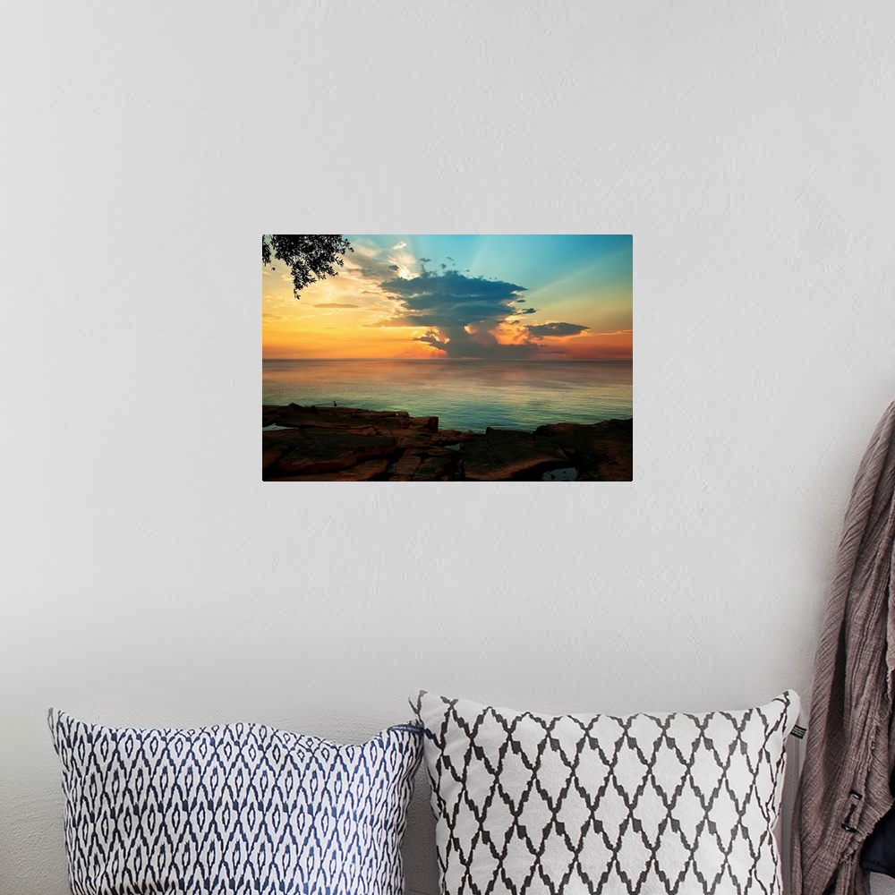 A bohemian room featuring Contemporary painting of the sun on the horizon, seen from across the water.