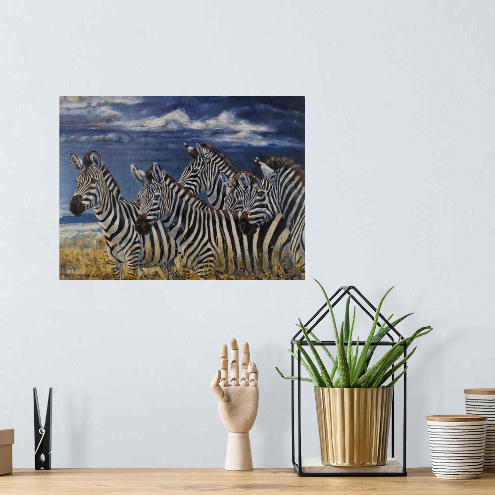 A bohemian room featuring Contemporary wildlife painting of a group of zebras on the Serengeti.