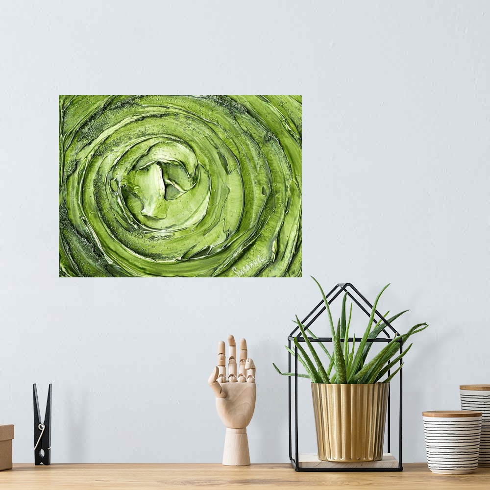A bohemian room featuring Large abstract painting with thick circular strokes and layers of paint in bright green and silver.