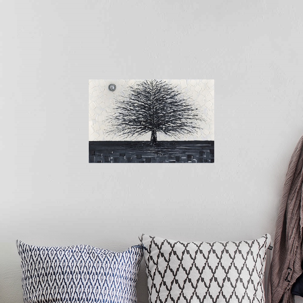 A bohemian room featuring Black and white tree landscape with layers of squares in the background.