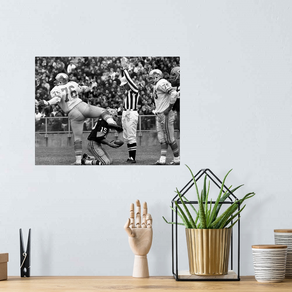 A bohemian room featuring Defensive tackle Roger Brown of the Detroit Lions exults after sacking quarterback Bart Starr of ...