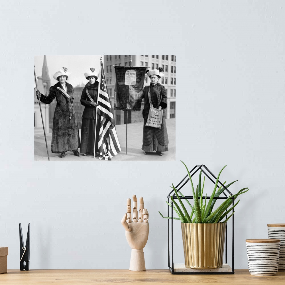 A bohemian room featuring Three women photographed on a Brooklyn rooftop before a demonstration for women's right to vote. ...