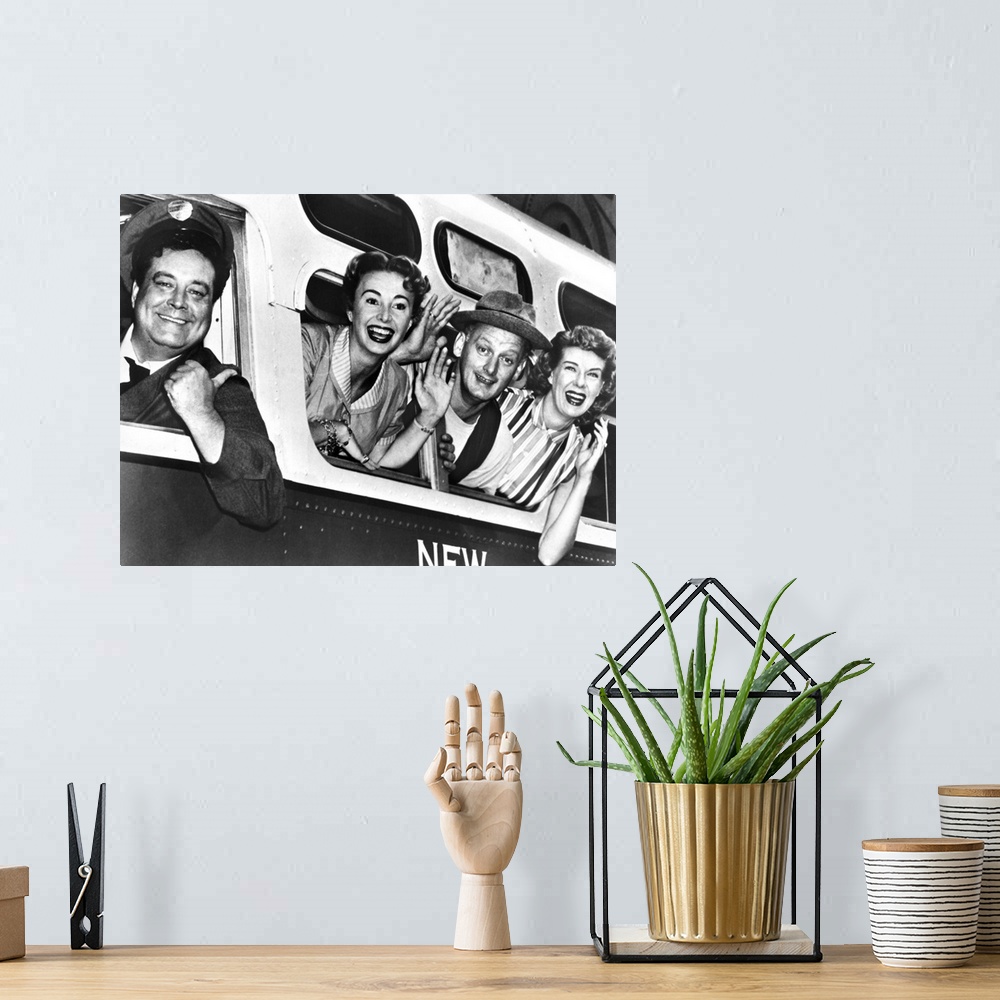A bohemian room featuring Left to right: Cast members Jackie Gleason, Audrey Meadows, Art Carney, and Joyce Randolph in a p...
