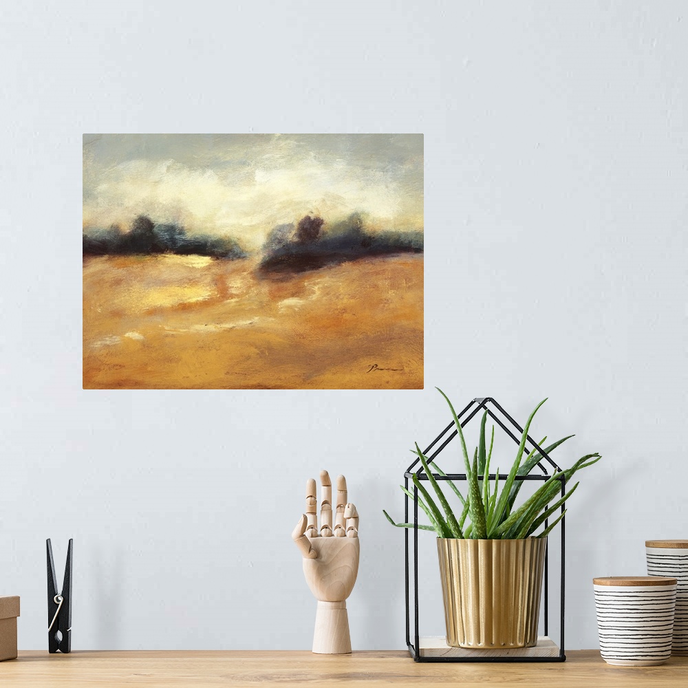 A bohemian room featuring Contemporary painting of a golden earthy toned landscape.