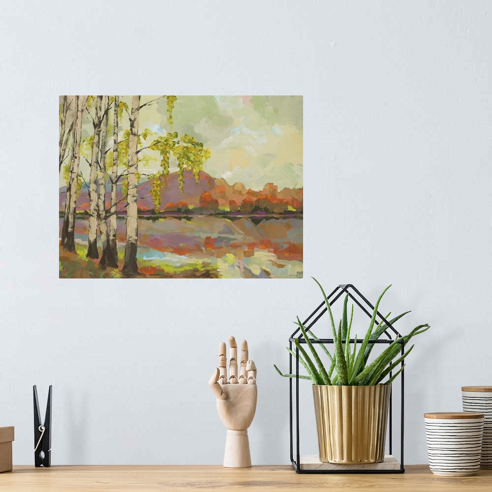 A bohemian room featuring A painting in the transitional style of birch trees by the side of a lake with mountains in the b...