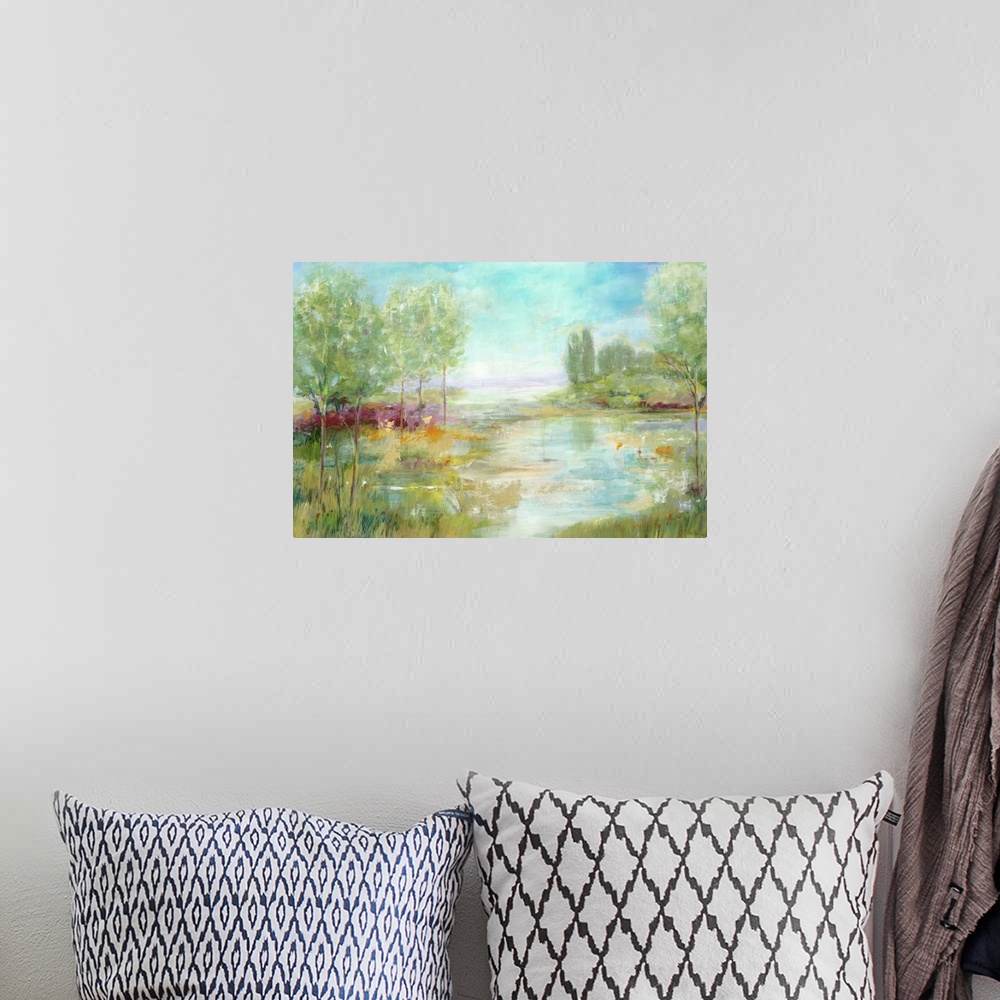 A bohemian room featuring Contemporary landscape painting looking out over lowlands surrounded by green foliage.
