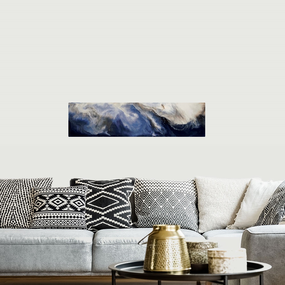 A bohemian room featuring Panoramic abstract painting with deep blue hues forming together with brown and white hues to cre...