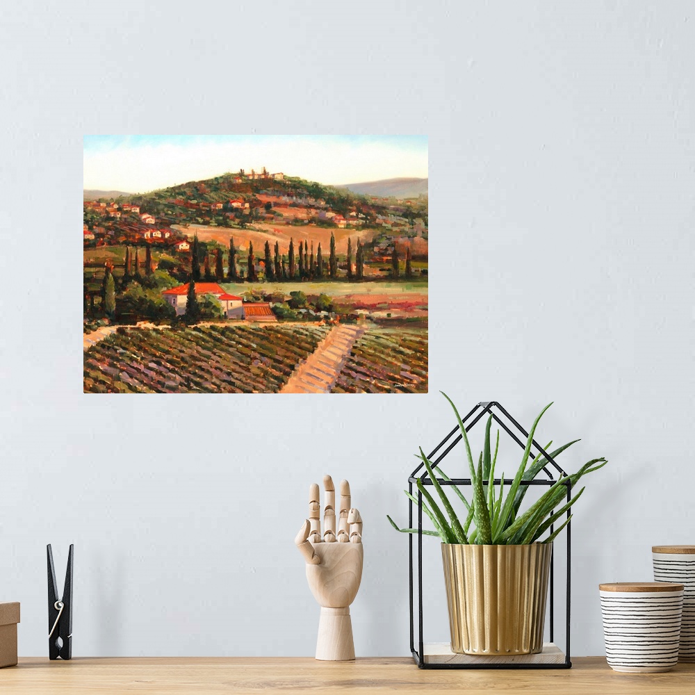 A bohemian room featuring Contemporary painting of a Tuscan landscape at sunset with vineyards and a village made with warm...