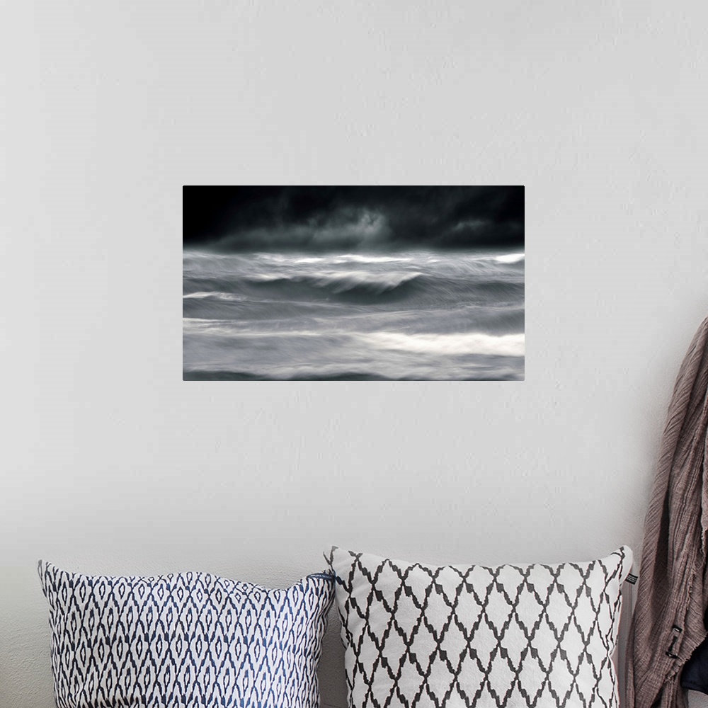 A bohemian room featuring Powerful waves in a seascape under a dark stormy sky