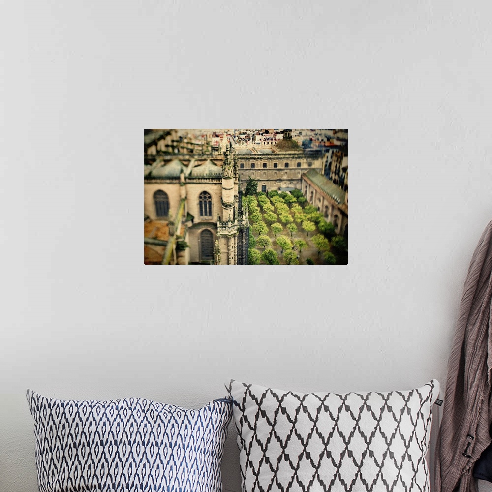 A bohemian room featuring View of the Cathedral and Orange Tree Yard from the top of the Giralda tower, Seville, Spain. Til...
