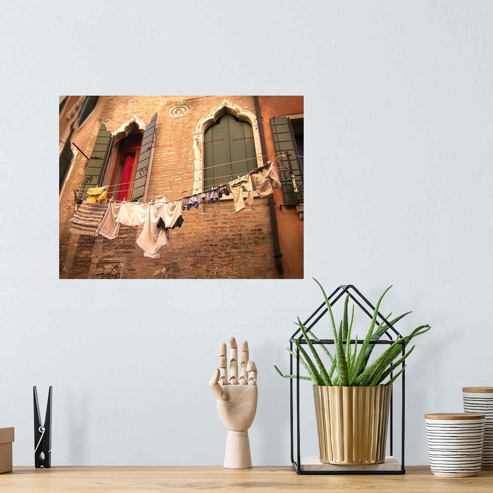 A bohemian room featuring Italian building with hanging washing